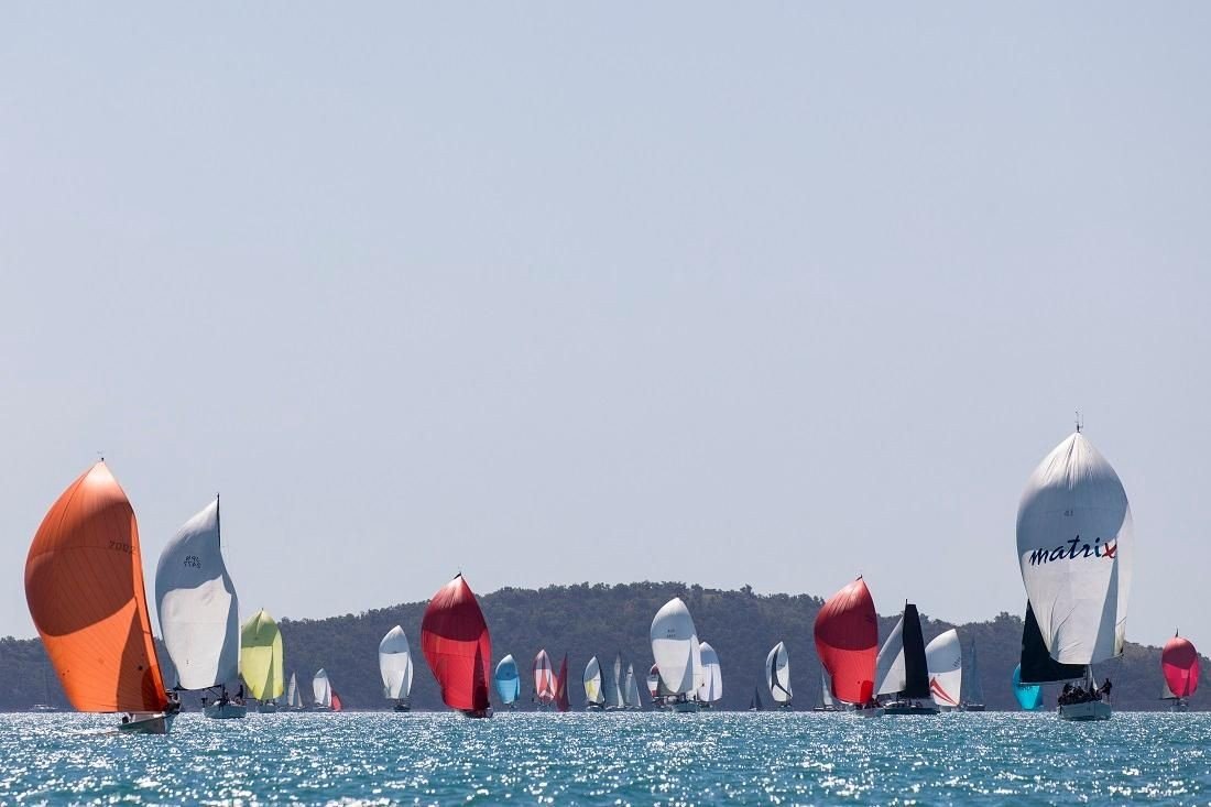 The racing is second to none at Airlie Beach Race Week - Photo: Andrea Francolini|||Who doesn't love the Long Lunch on the Lawn at WSC - Photo Andrew Pattinson/Vampp Photography|Yachties mix it with visitors after racing at Whitsunday Sailing Club - Photo: Andrew Pattinson / Vampp Photography|