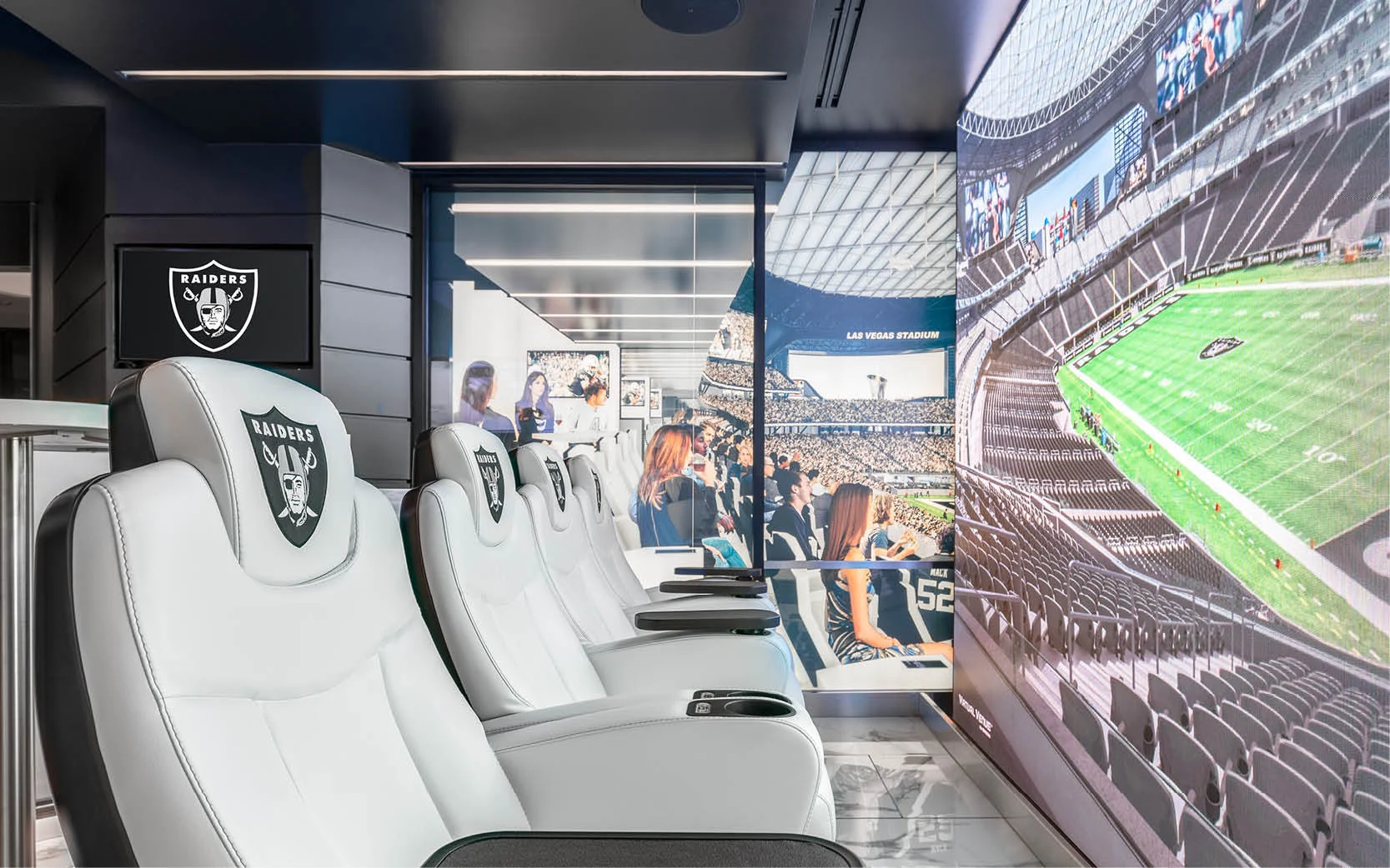 A mock suite provides a view into Raiders stadium, featuring furniture, fixtures and premium amenities available at the new stadium.