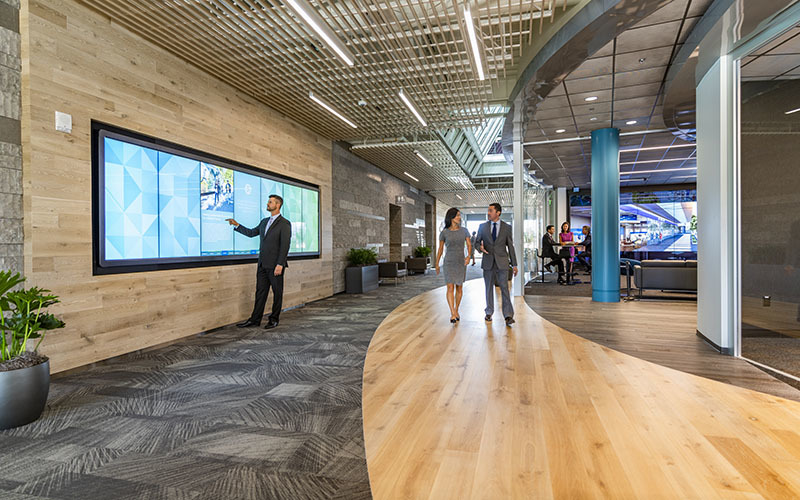 After check-in is complete and guests have idle time they can explore the center on their own. The Possibility Wall senses proximity and encourages visitor to interact as they walk by.