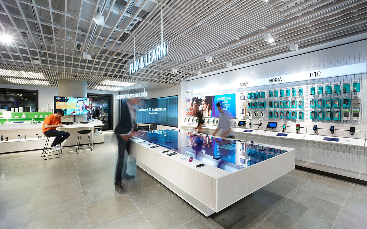 This play and learn table, now called the Sandbox, invites customers to compare mobile devices side by side. 