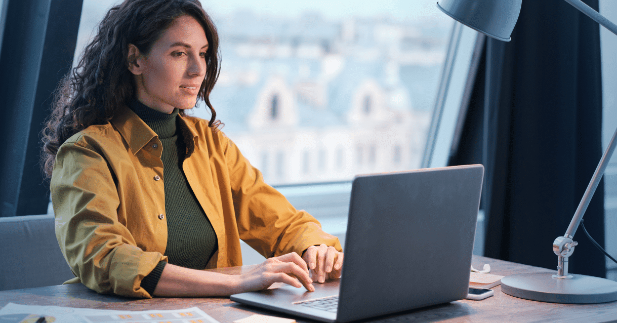 Business woman typing on a computer