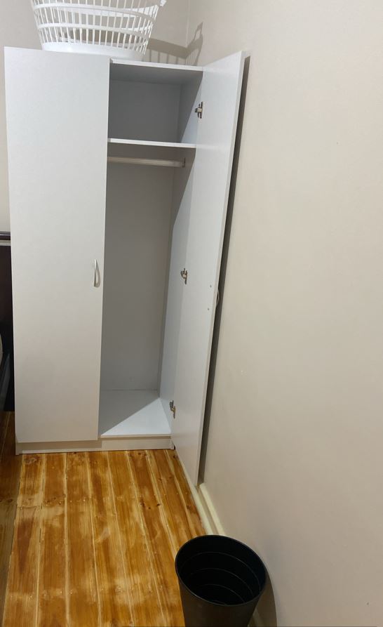 Open wardrobe with shelves and hanging space