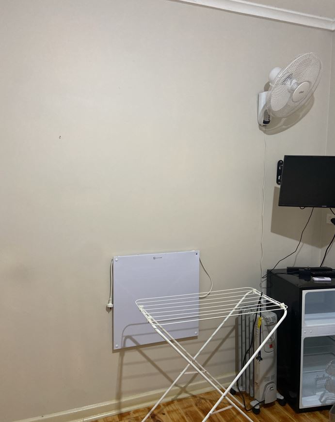 chair and desk TV bar fridge wall heater