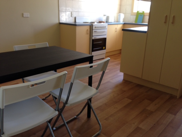 Elizabeth Grove share house Kitchen Bench and Dining Area Stove shared space