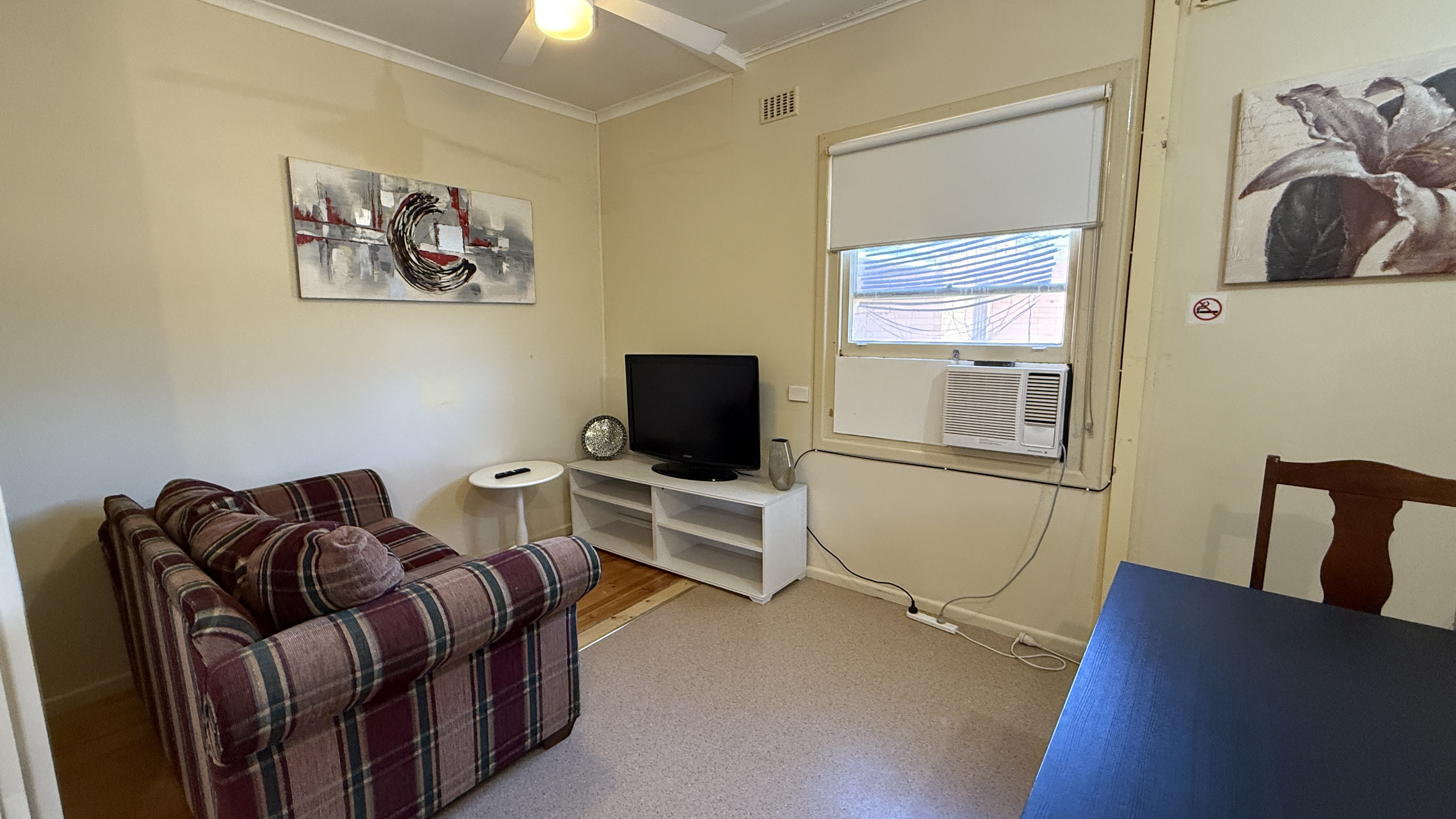Elizabeth Downs share house Shared living room with sofa, TV unit and natural light shared space