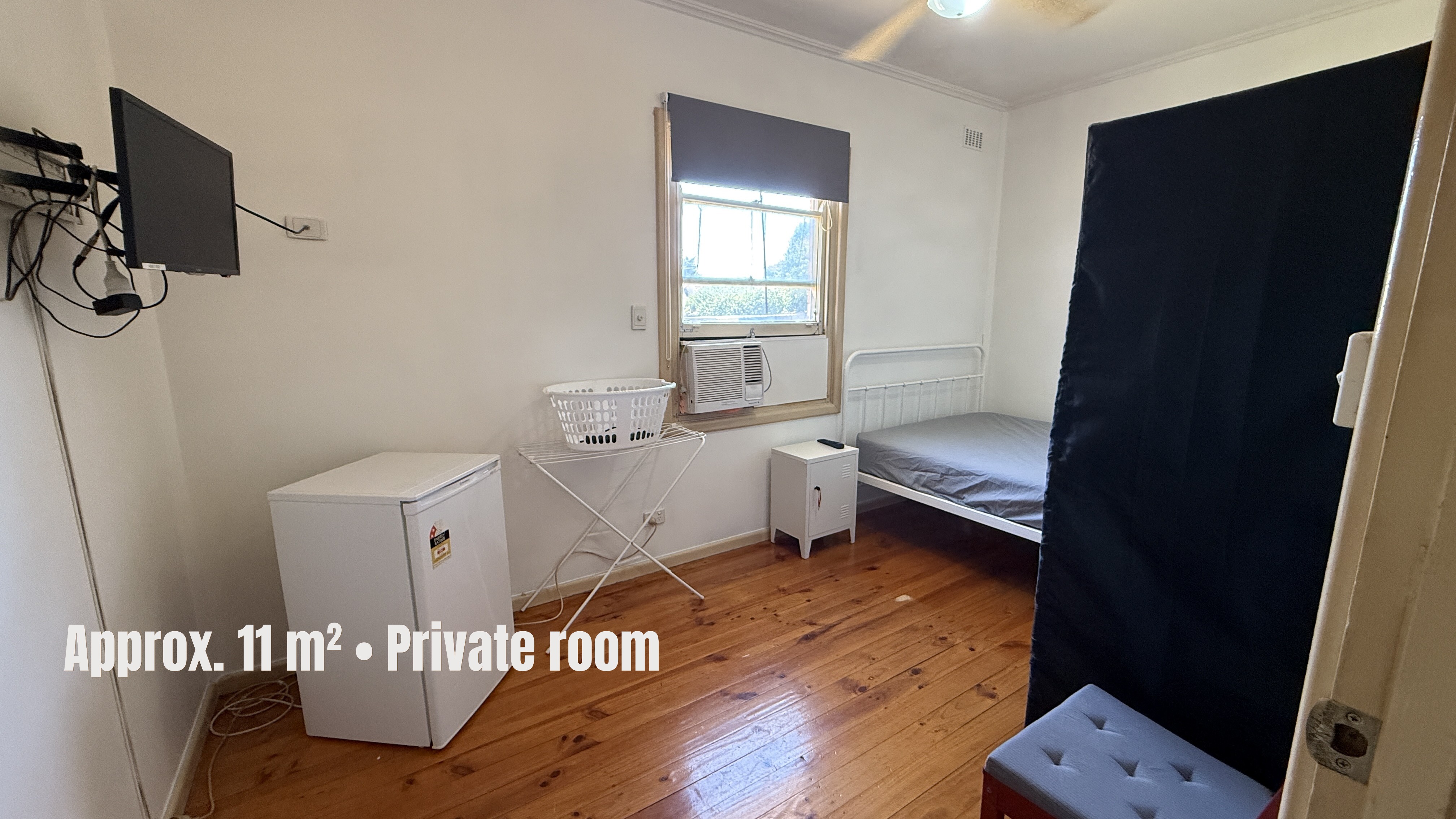 Elizabeth Downs share house Fully furnished bedroom with bed, wardrobe, TV, window and timber flooring