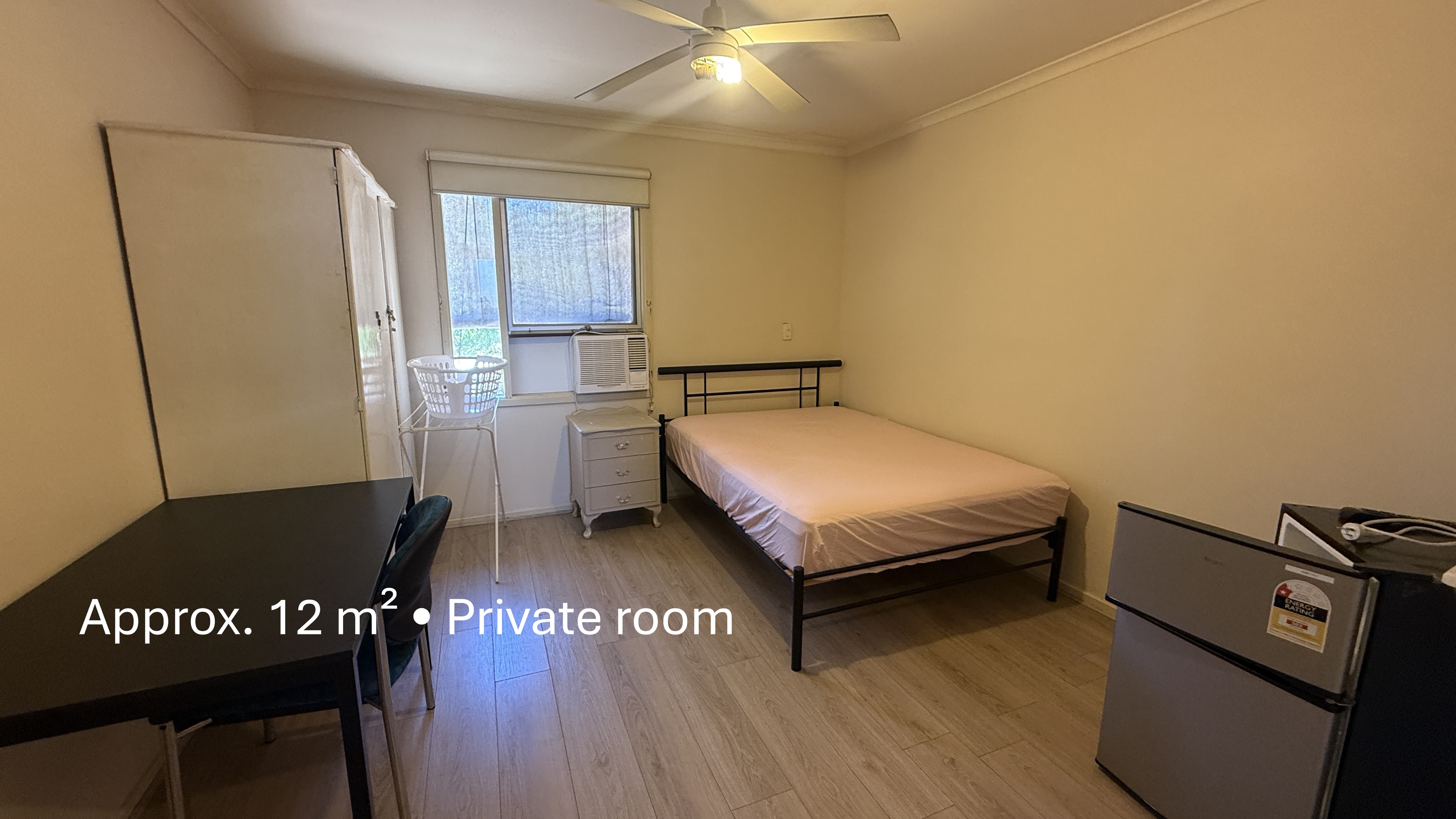 Elizabeth Park share house Bedroom  Layout with bed, desk, wardrobe, air conditioner, timber flooring