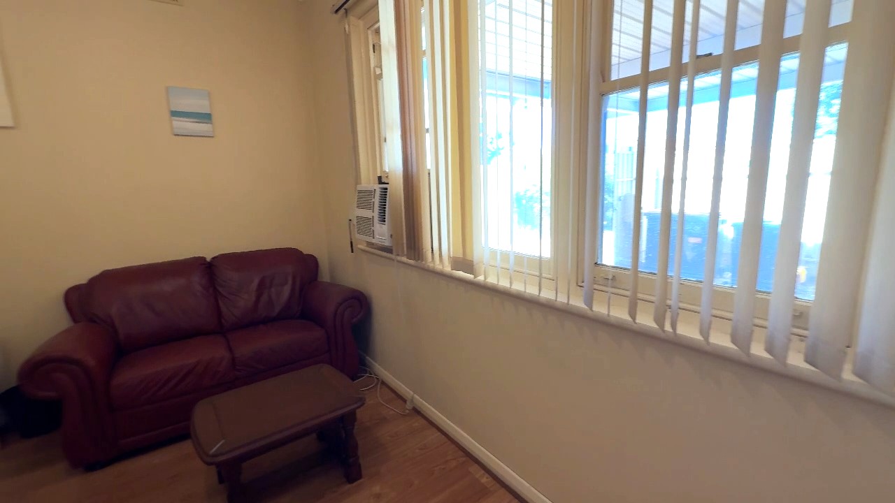 Salisbury Downs share house Comfortable shared living room with sofa and natural light shared space