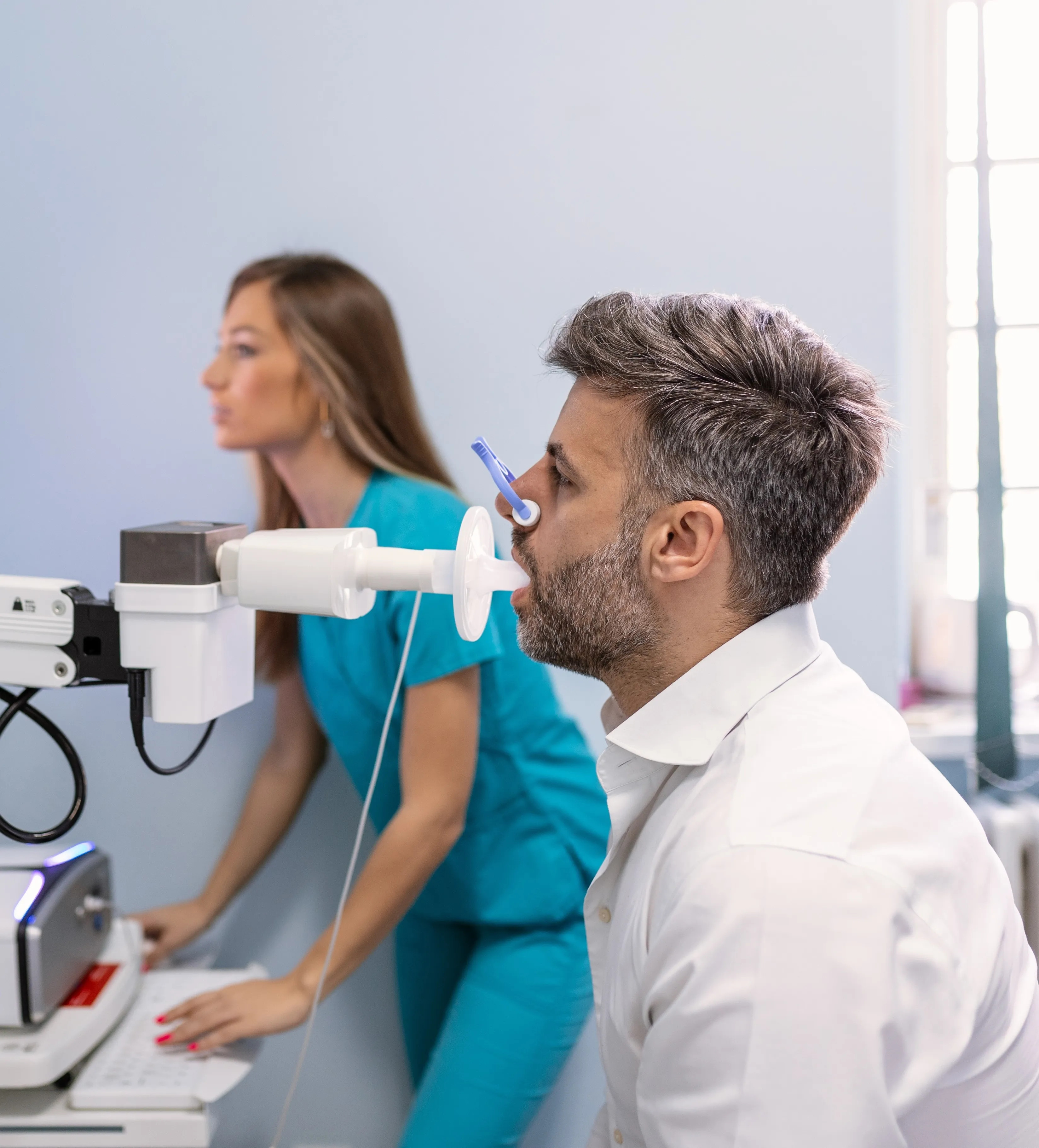 Clinical technician preparing a patient for a diagnostic test