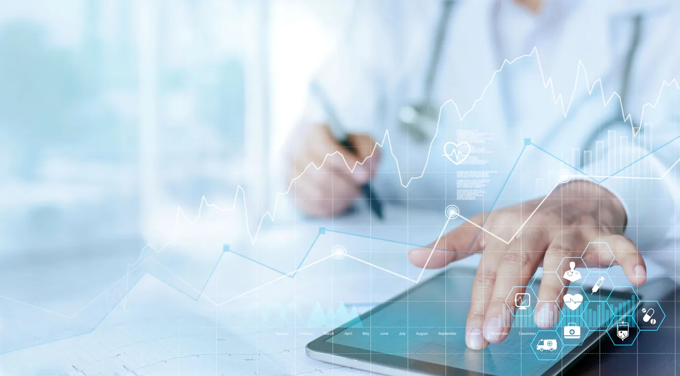 A clinician using a tablet, overlaid with graphics representing healthcare data and reporting