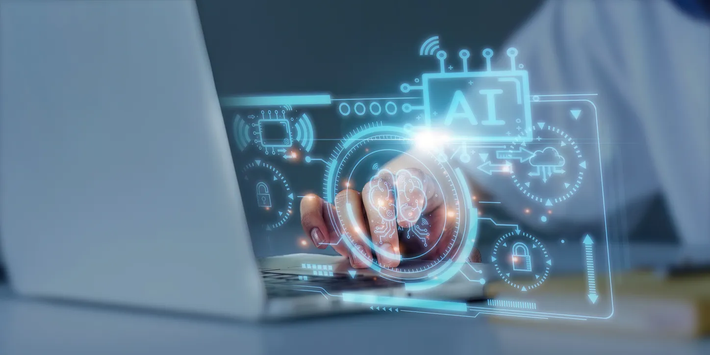 A clinician using a laptop, overlaid with graphics representing AI in healthcare
