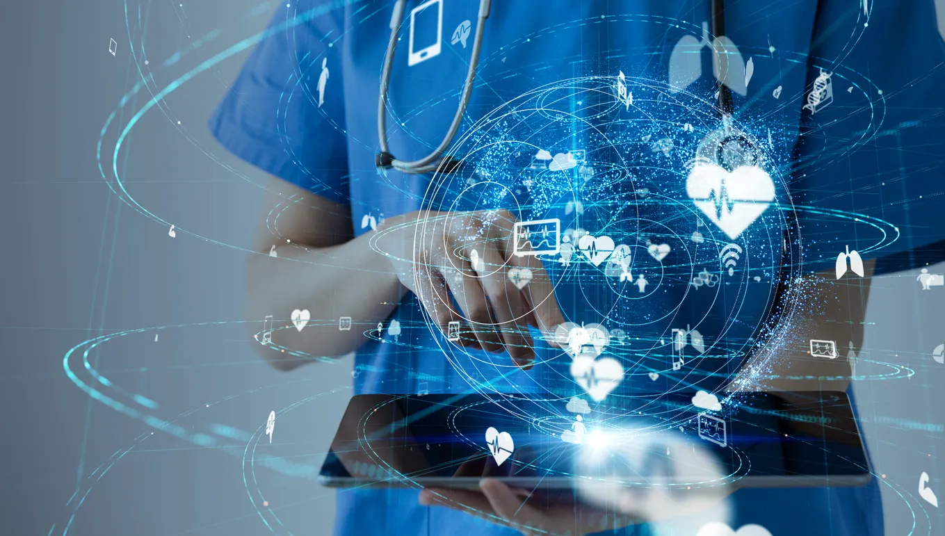 A clinician holding a tablet, overlaid with graphics representing connected health systems