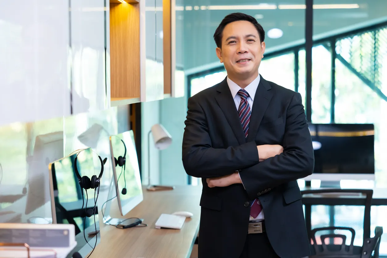 Healthcare executive standing in a modern practice office