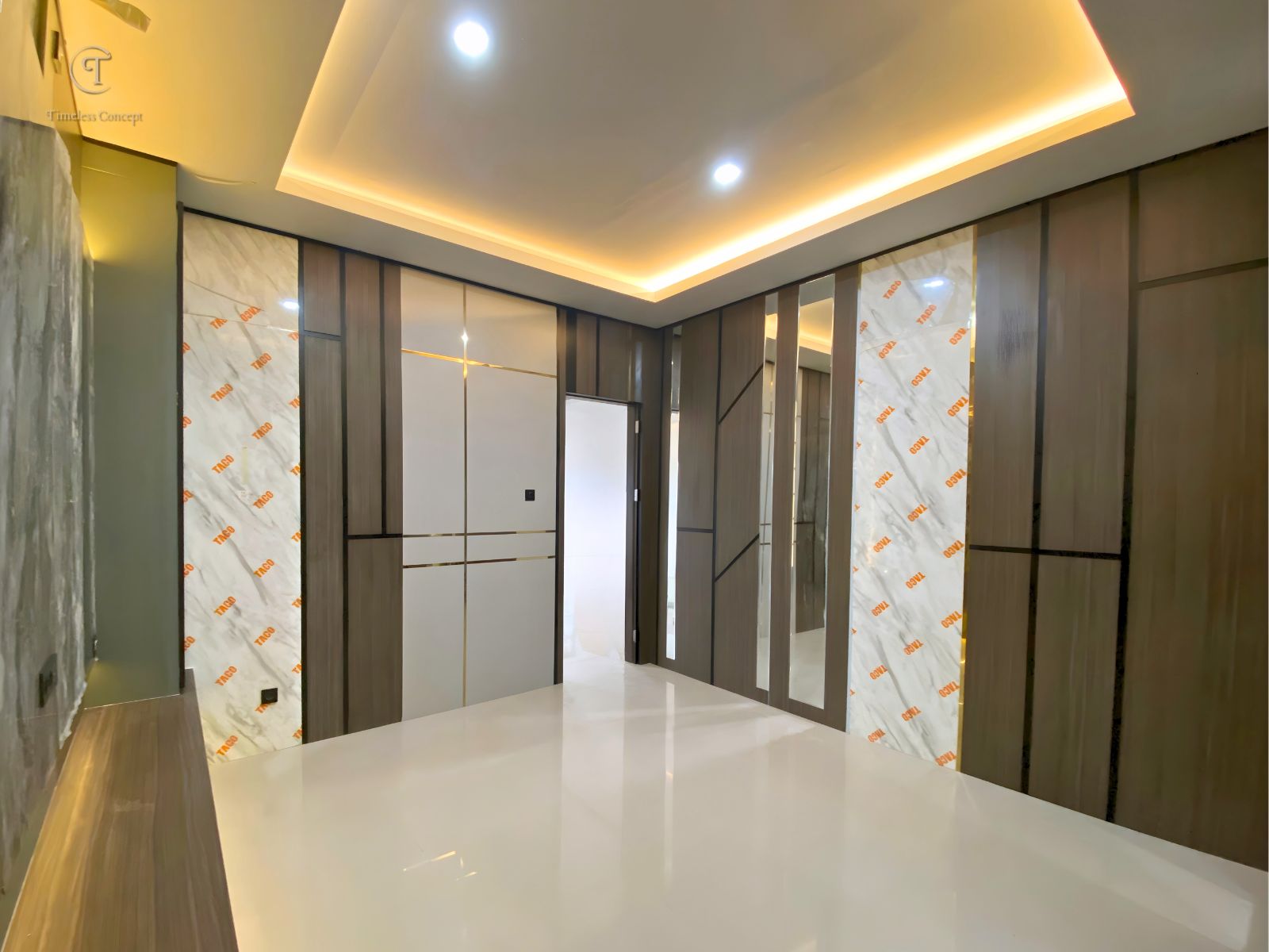 Inviting Living Room with Dark Brown HPL Panels, Warm Lighting, and Cozy Atmosphere for Ultimate Comfort