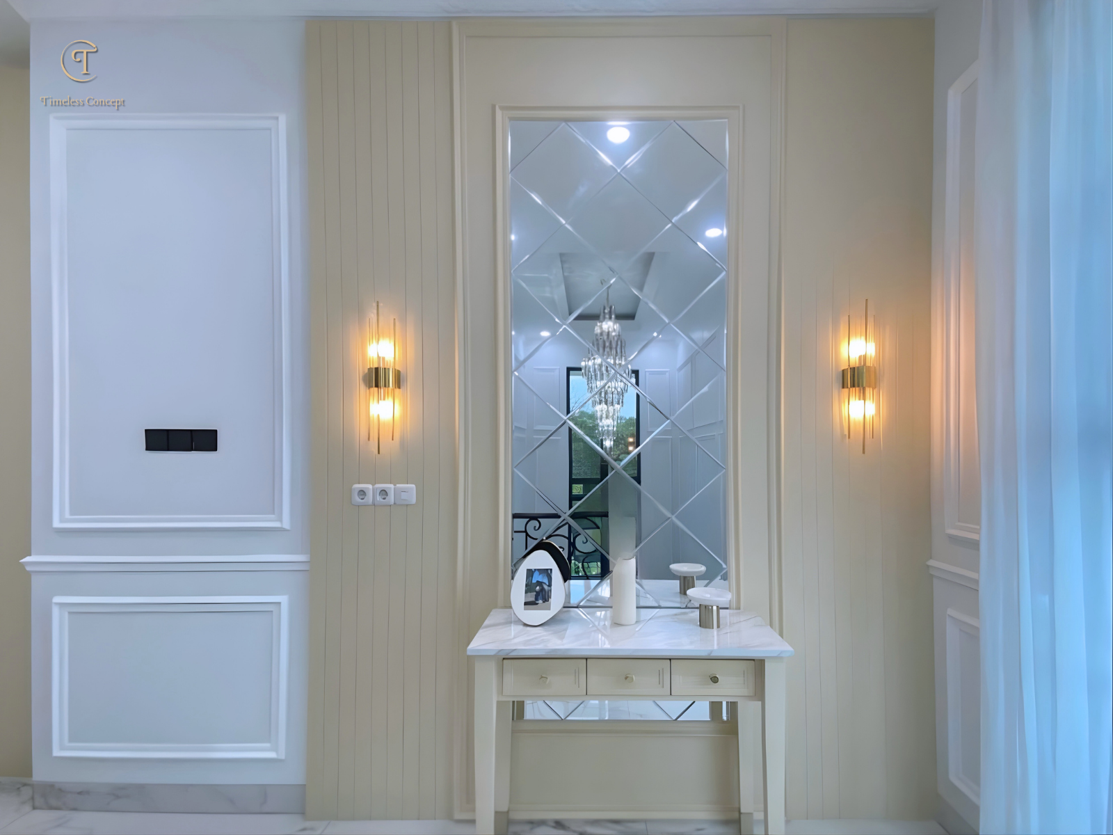 Living Room Design with Stair Access Embellished with Wall Molding and Elegant Decorative Mirrors