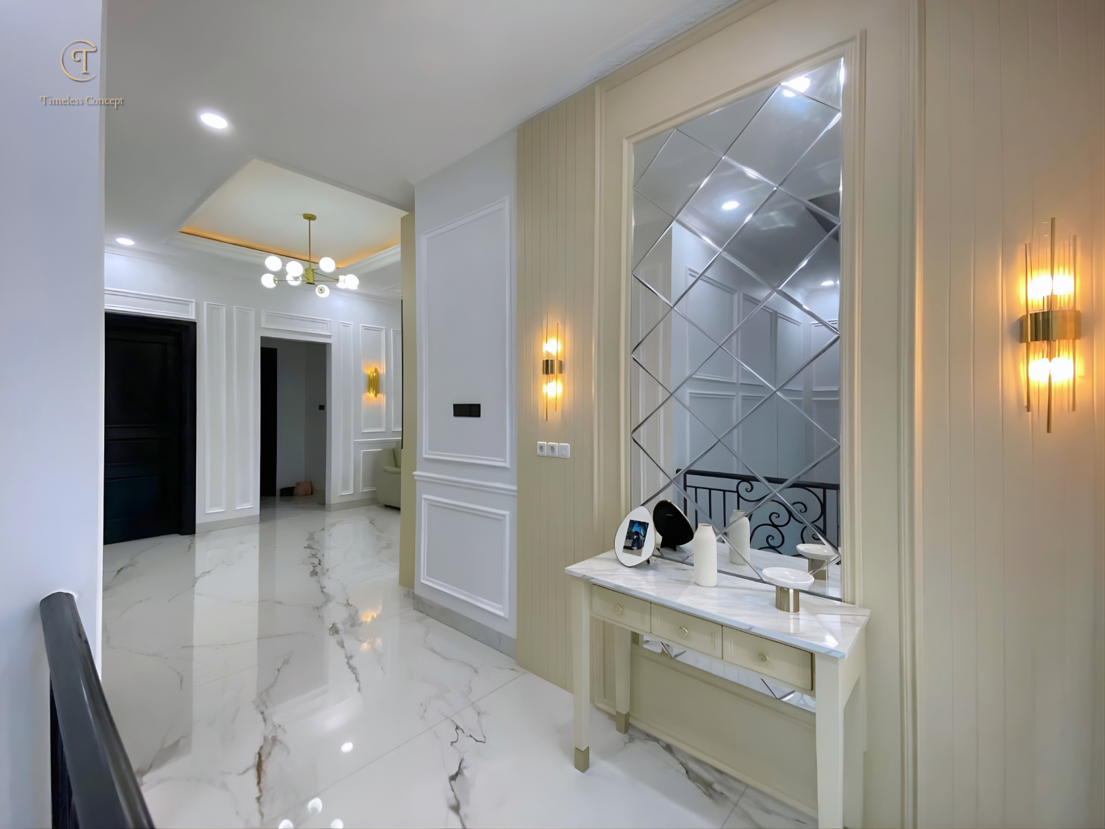 Living Room Design with Stair Access Enhanced by Wall Molding Details, Elegant Decorative Mirrors, and a Touch of Modern Classic Interior Style