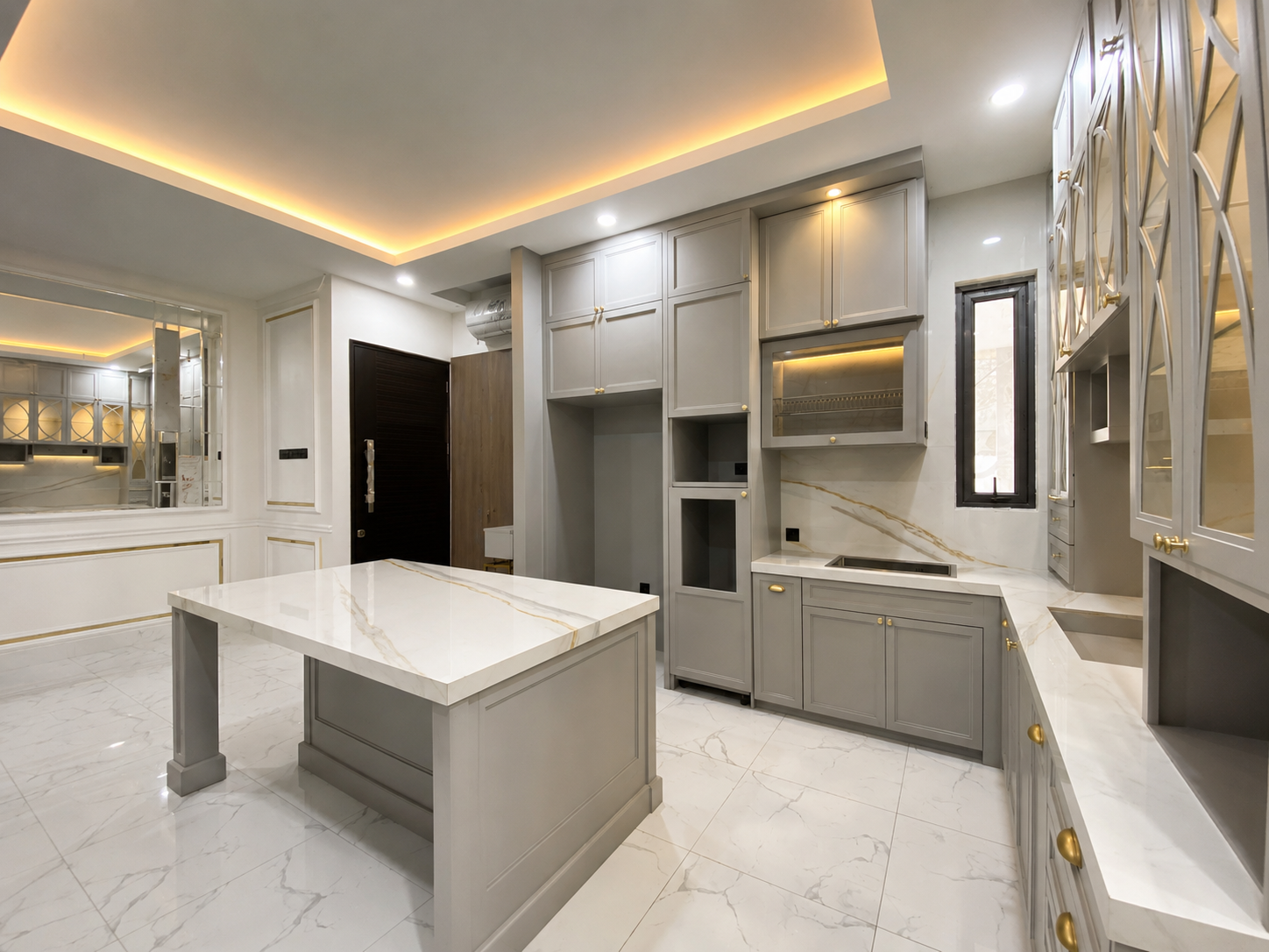 An elegant blend of colors, premium materials, and modern details creates a kitchen that is luxurious, warm, and timeless.
