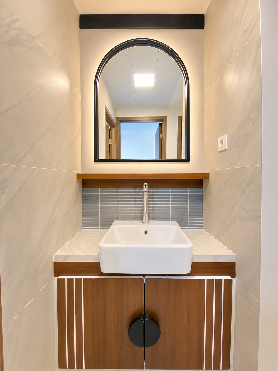 A Warm Modern Bathroom Vanity blends natural wood tones, elegant finishes, and clean contemporary lines to create a cozy yet sophisticated bathroom.