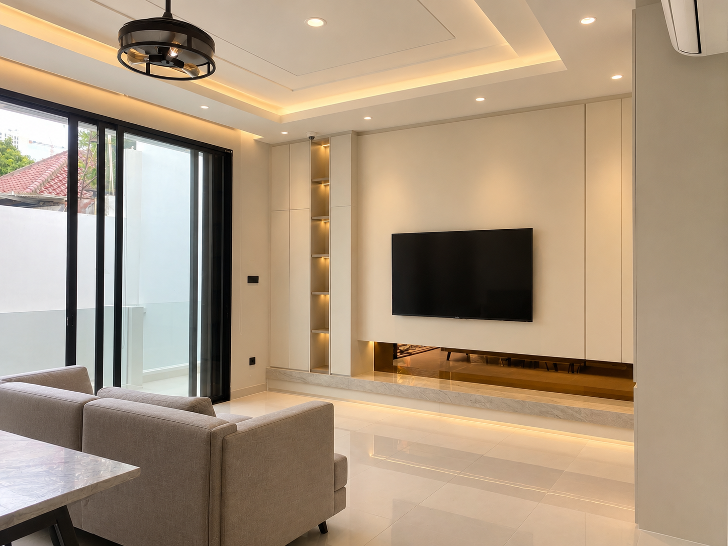 Neutral colors and clean architectural lines create a spacious, peaceful, and inviting atmosphere. Every detail is thoughtfully designed to balance style, comfort, and functionality. Large glass doors bring natural light into the room, enhancing its bright and elegant appearance. Get inspired by these beautiful living room ideas and transform your home into a luxurious, modern sanctuary with timeless minimalist charm and sophisticated interior design.