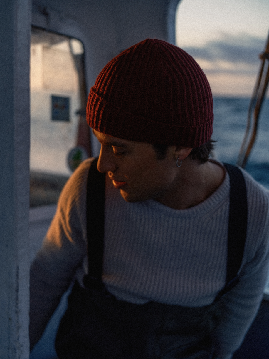 Man with red fisherman beanie