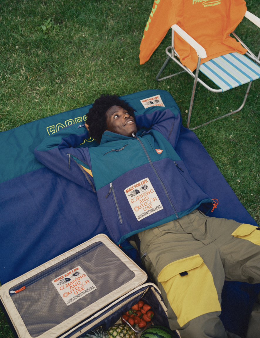 Man laying down in camping gear