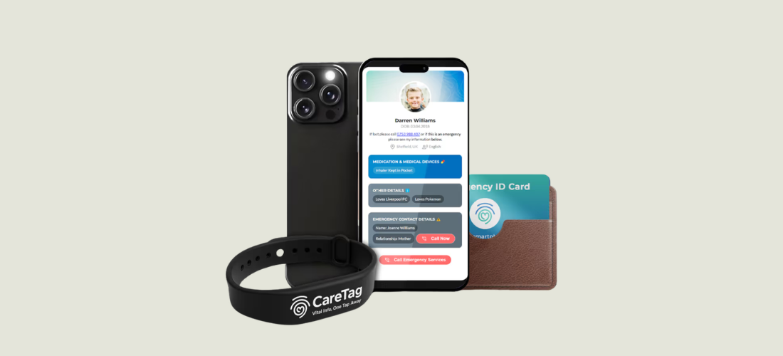 CareTag emergency ID kit showing a black NFC-enabled wristband and blue emergency ID card resting on a smartphone, used to access vital medical information in emergencies.