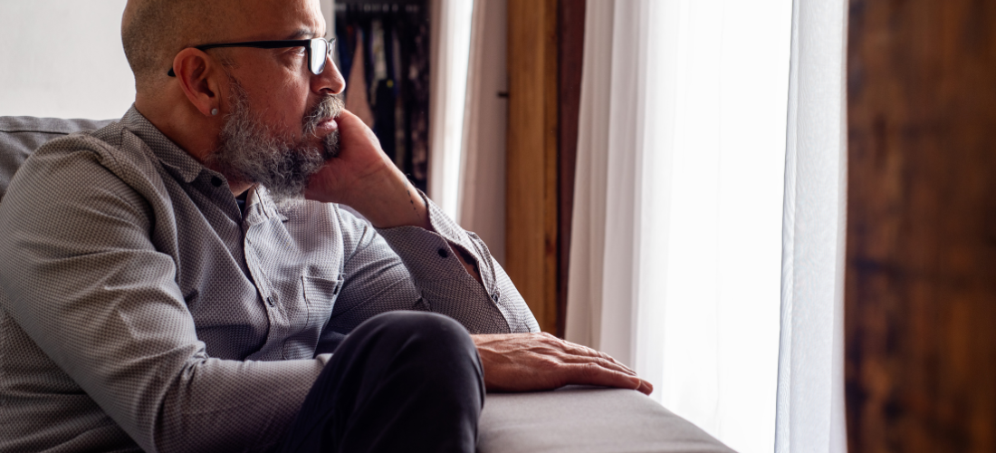 CareTag emergency ID kit showing a black NFC-enabled wristband and blue emergency ID card resting on a smartphone, used to access vital medical information in emergencies.