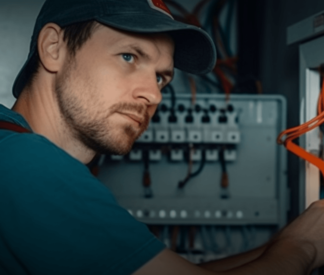 electrician working on electrical panel