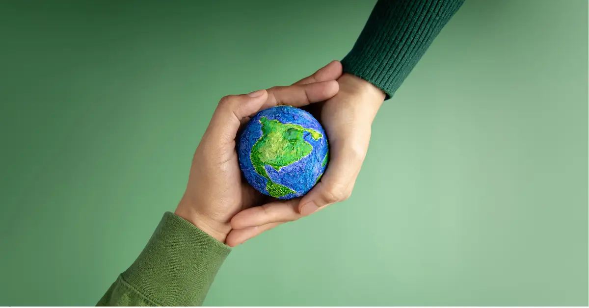 ESG reporting solutions symbolized by hands holding a small globe, emphasizing environmental and social responsibility