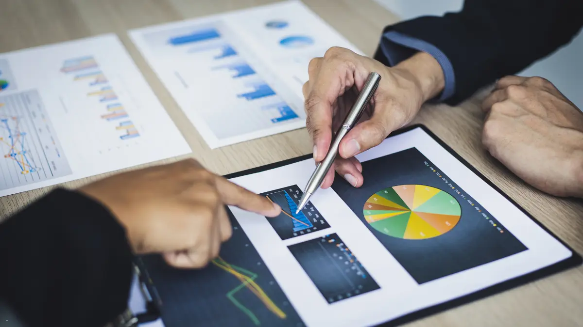 Technology for supplier risk assessment visualized with detailed graphs and charts being reviewed collaboratively