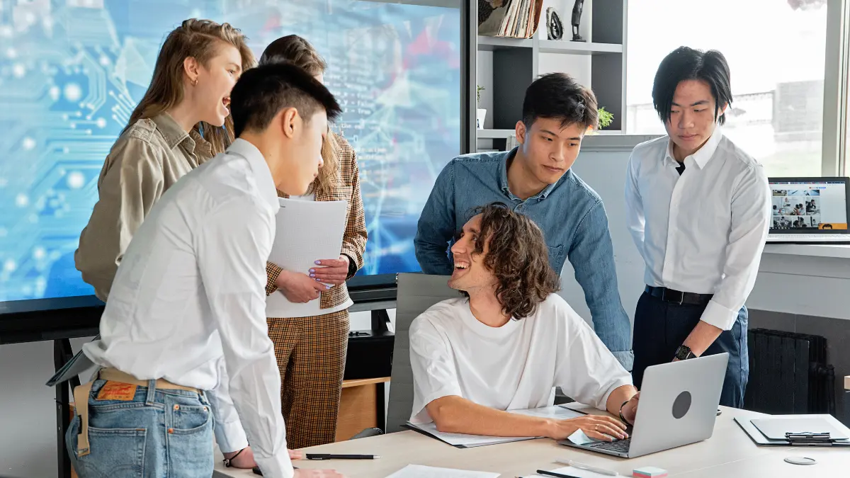Risk management for third parties team collaborating on a project in a modern tech workspace.