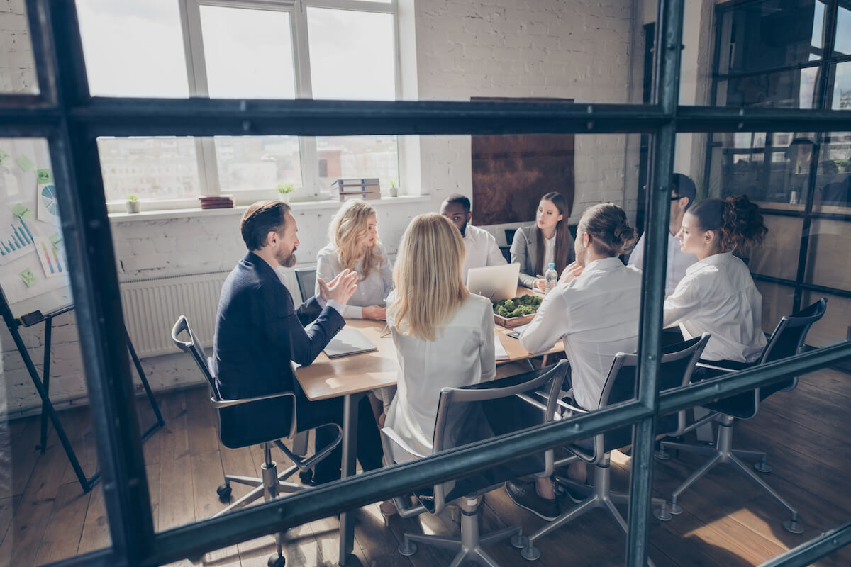 Employees having a meeting at an office