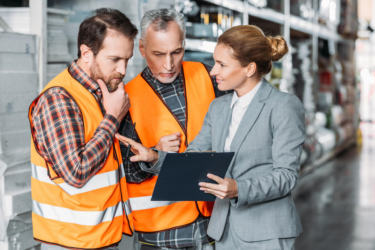 Supplier risk management: workers talking to an entrepreneur