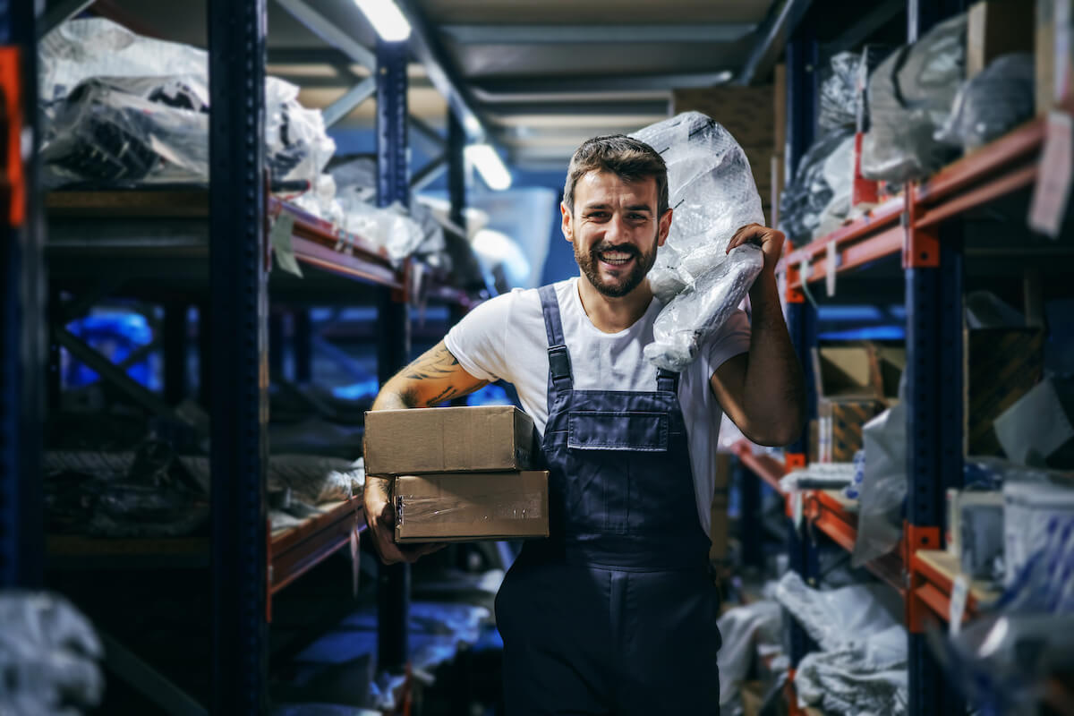 Supplier risk management: worker happily carrying some stuff