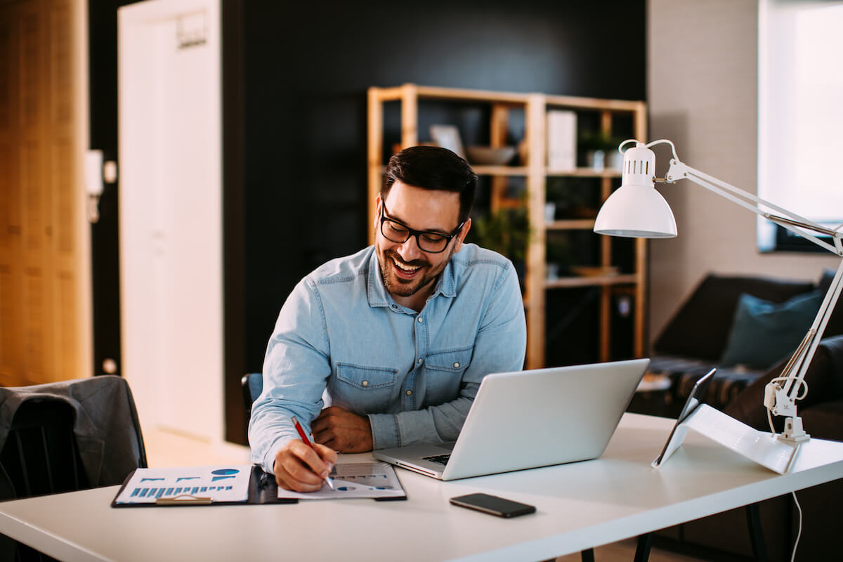 KYC verification: entrepreneur writing on a document