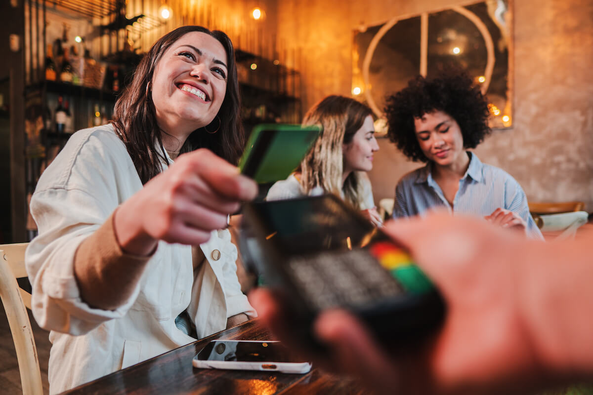 Woman paying using her credit card