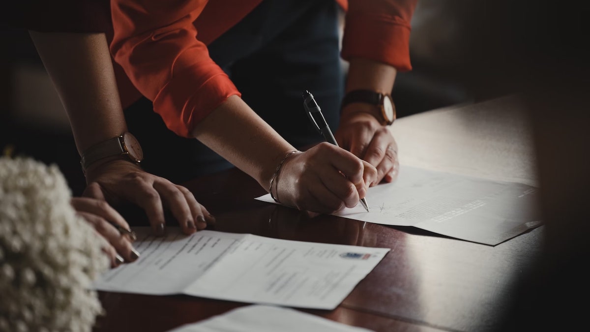 CCPA vs CPRA: person signing a contract