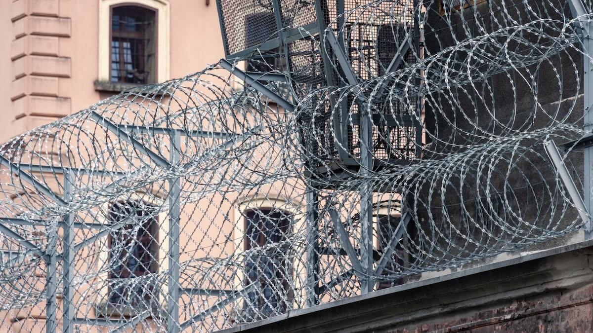 Vendor compliance: barbed wires on a fence
