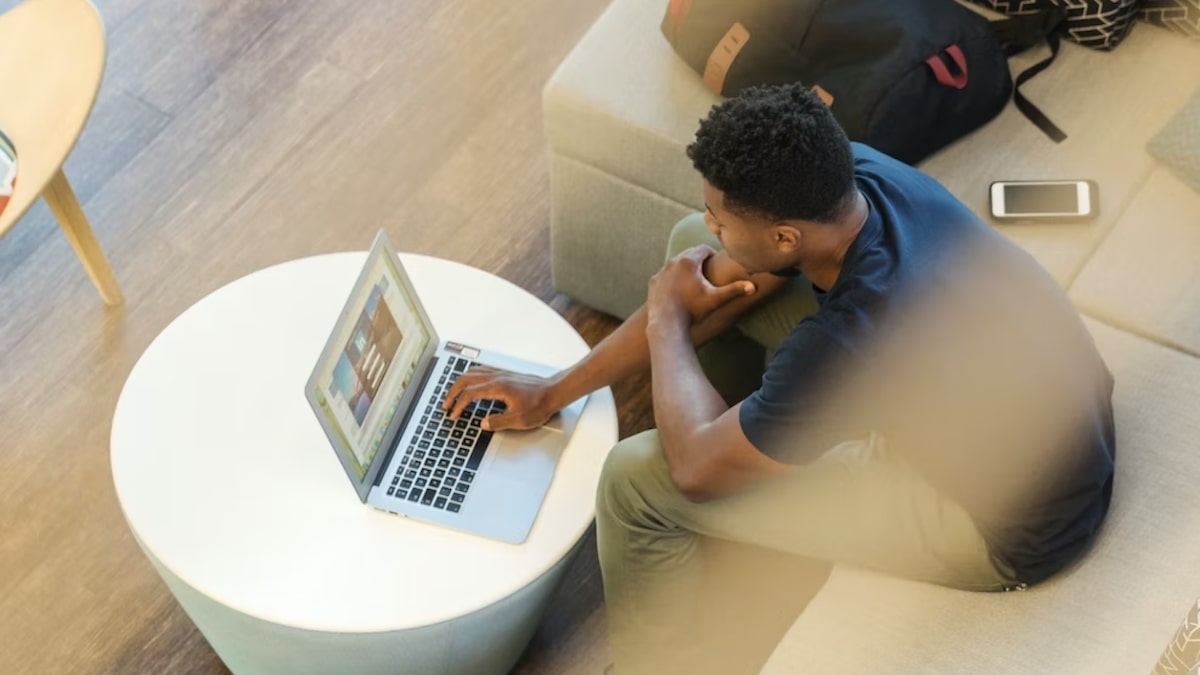 GLBA: man using a laptop