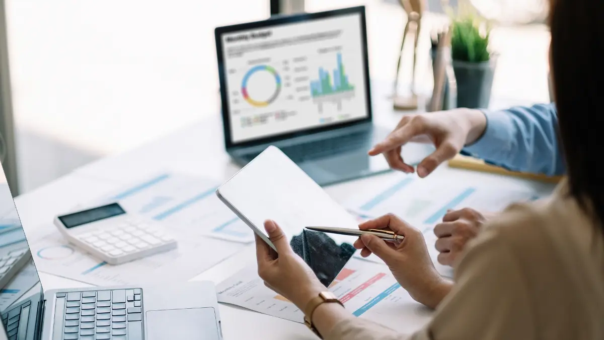 Risk analysis platform showing data charts and reports discussed by business analysts.