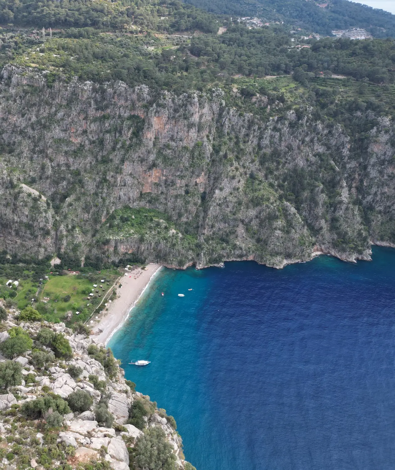 Butterfly Valley Beach in Turkey offers turquoise waters, dramatic cliffs, and a secluded paradise for hikers and nature lovers along the Lycian Way.