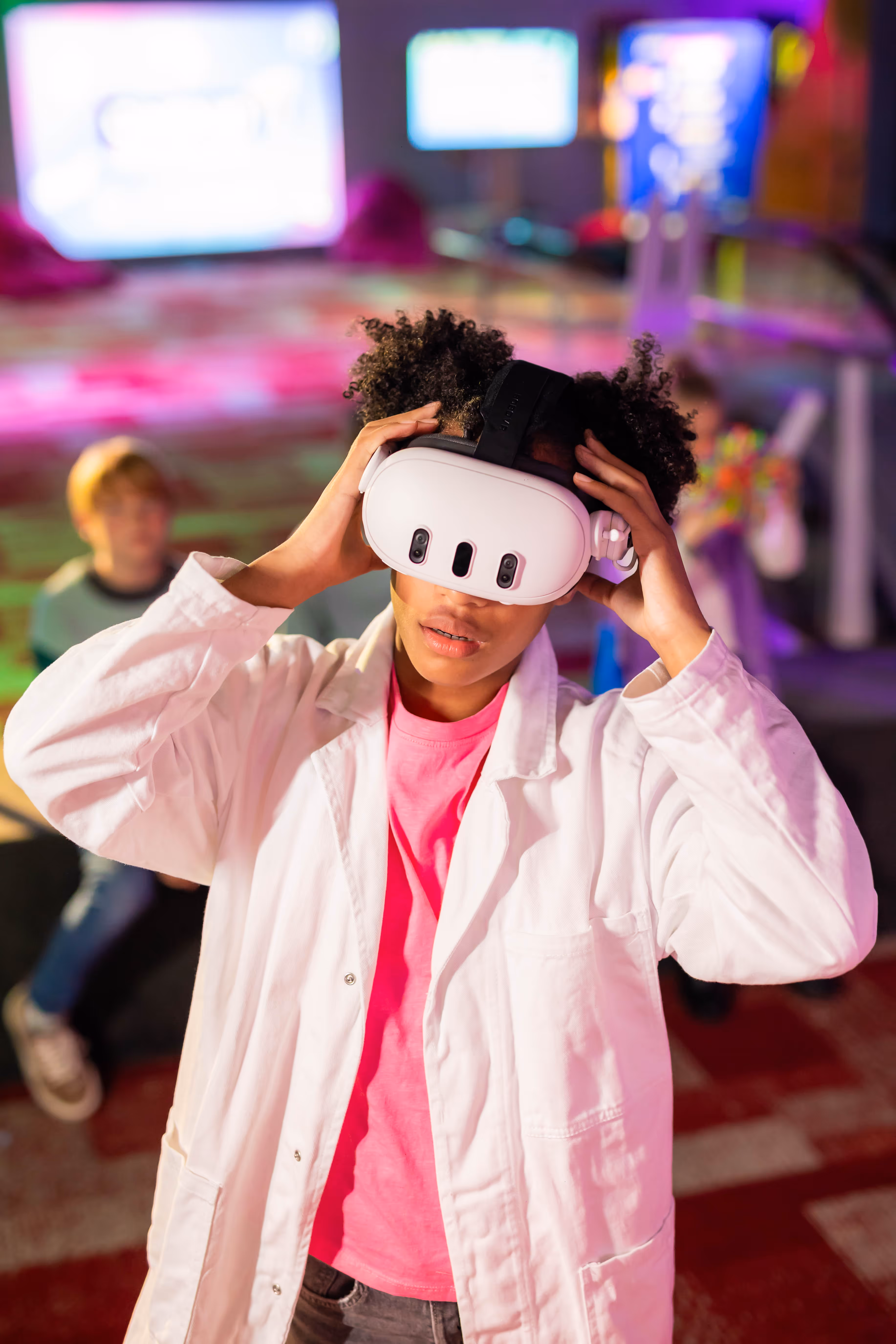 Young participant wearing a VR headset while exploring Chaos in the Lab at Cinekid Festival’s Medialab