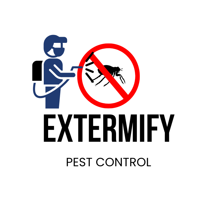 Roofer in safety harness kneeling on a sloped residential roof, preparing shingles against a backdrop of houses and tree-lined streets.