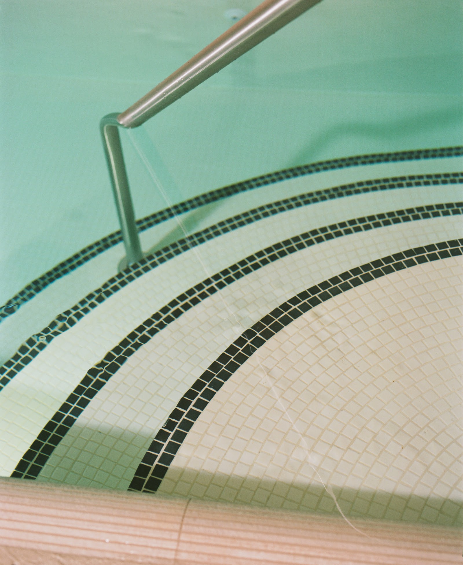 Cold plunge pool with warm red marble at Lore Bathing Club