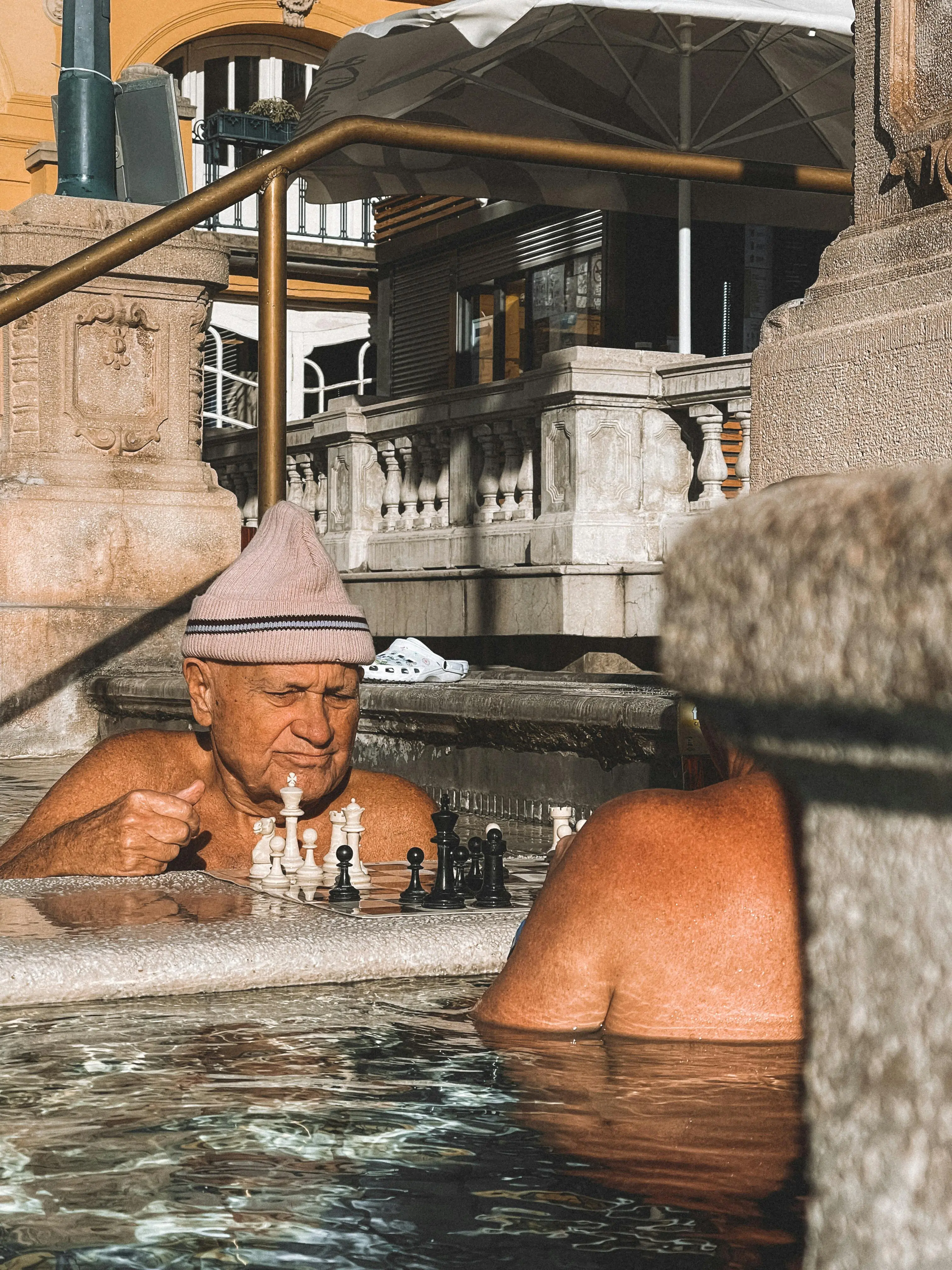 Bathers in the thermal pool at Lore
