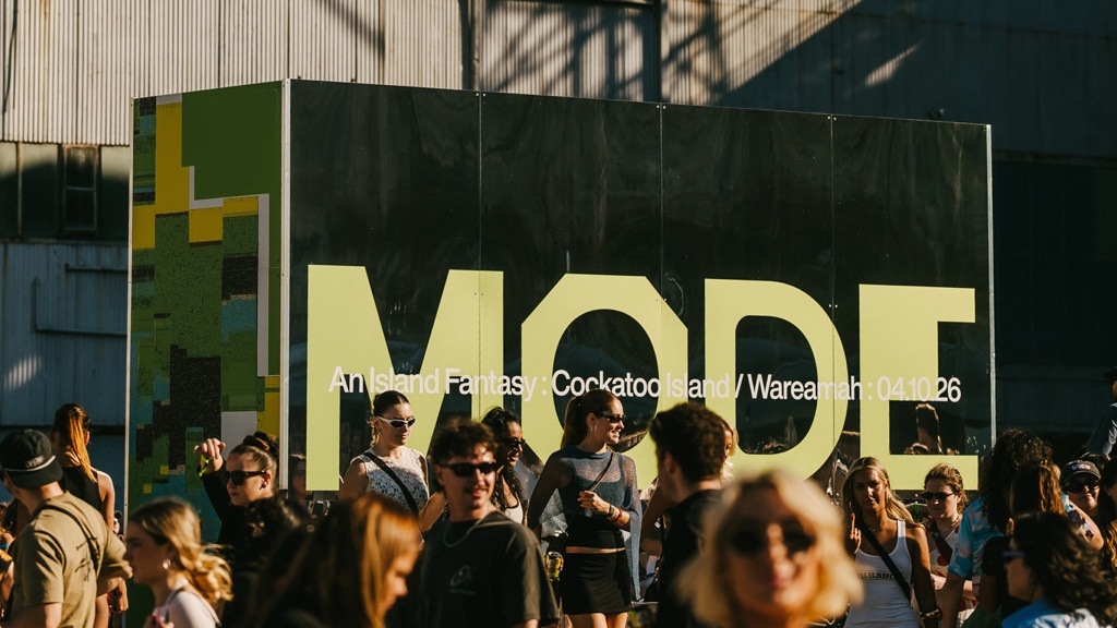 Mirrored MODE Festival welcome wall framed in daylight. Photo: Jordan Munns.