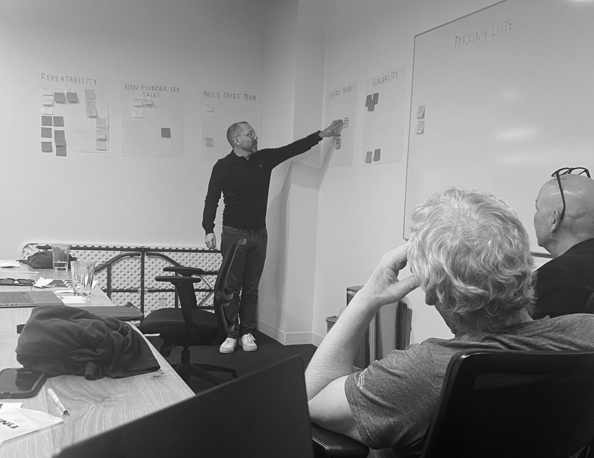 A black and white photo of RVNU Strategy Workshop in progress