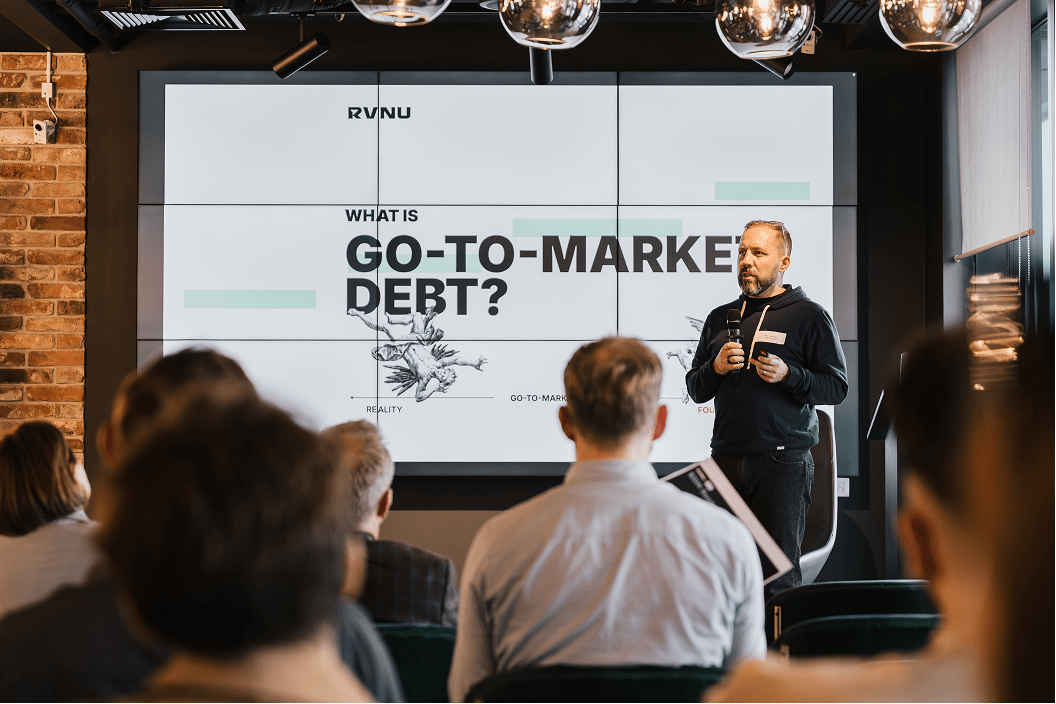 Photo of Wayne Morris from RVNU is giving a presentation on GTM Debt