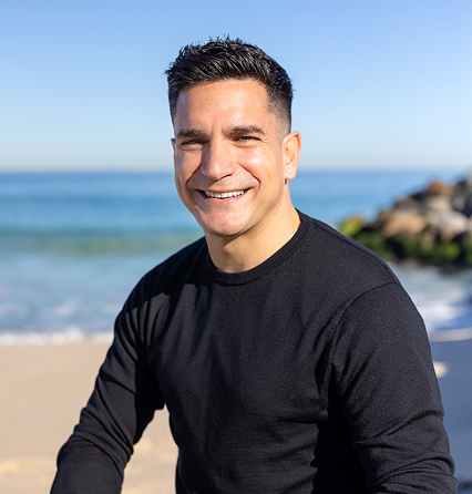 Chris Tonich sitting on the rocks in City Beach, Perth WA