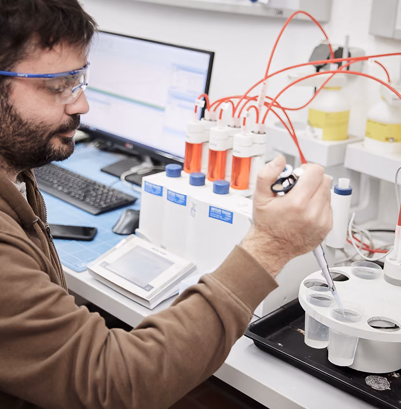 Employee testing materials in the laboratory